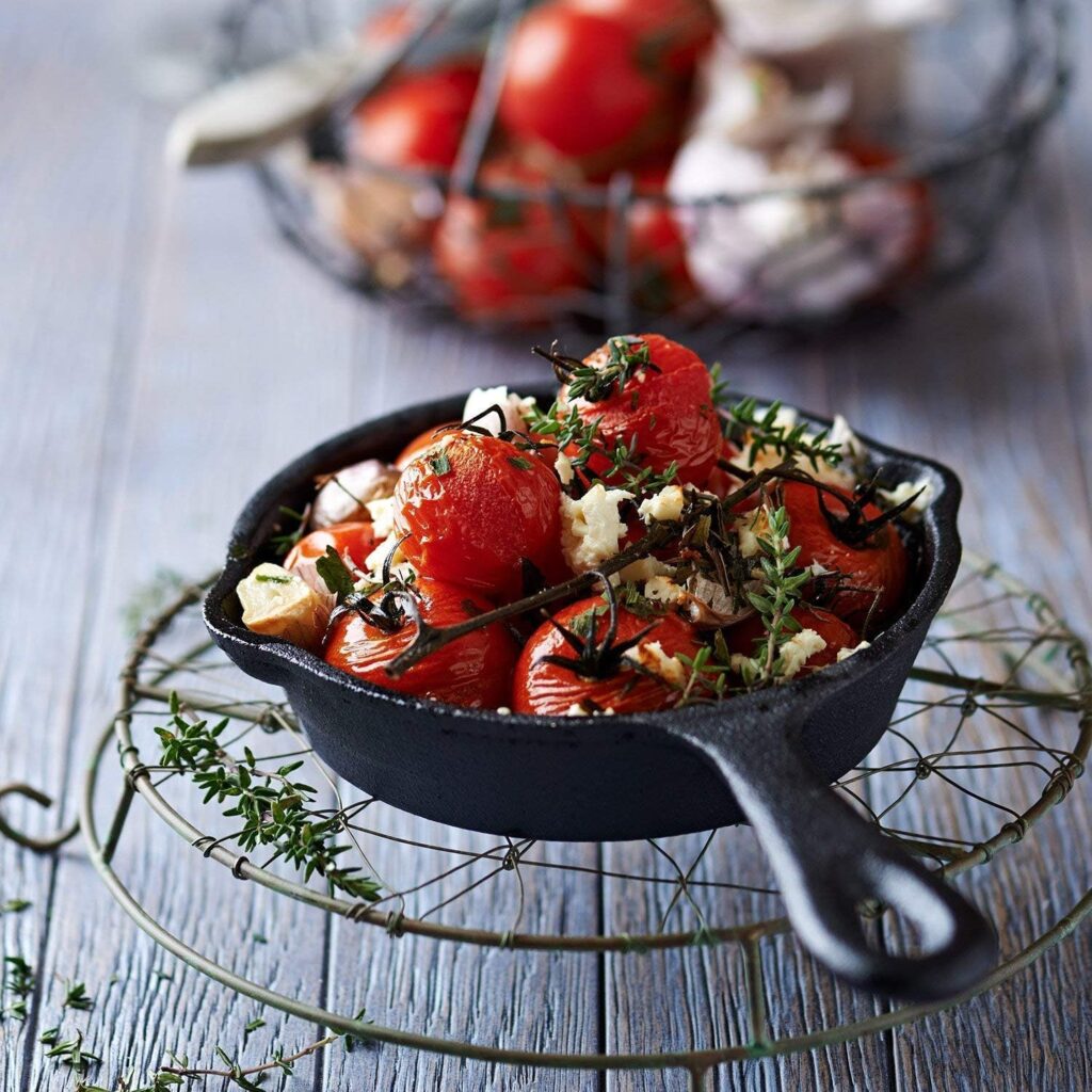 Delicious food cooking in a small cast iron skillet